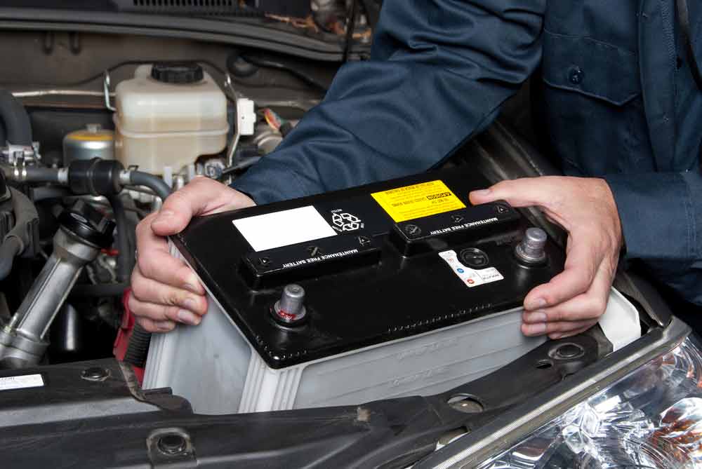 Car Mechanic Replaces Car Battery